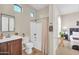 Clean, well-lit bathroom features a shower, a single sink, and classic fixtures, exuding functional simplicity at 3125 W Desert Ln, Laveen, AZ 85339