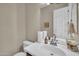 Bathroom featuring a sink with a modern faucet and vanity with a white countertop at 3125 W Desert Ln, Laveen, AZ 85339