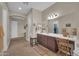 Bathroom with a large vanity with double sinks, neutral color palette, and separate toilet room at 3125 W Desert Ln, Laveen, AZ 85339