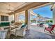 Stylish covered patio offering a relaxing outdoor living space with views of the pool and backyard oasis at 3125 W Desert Ln, Laveen, AZ 85339