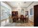 Formal dining room with chandelier, wood floors, and elegant furnishings at 3125 W Desert Ln, Laveen, AZ 85339