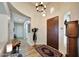 Open foyer with hardwood floors, arched doorways, and a view of the home's interior at 3125 W Desert Ln, Laveen, AZ 85339