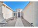 Elegant entryway showcasing a decorative front door, desert landscaping and a welcoming walkway at 3125 W Desert Ln, Laveen, AZ 85339