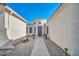 Beautiful home entrance featuring a walkway leading to a grand front door and a cylindrical tower entry at 3125 W Desert Ln, Laveen, AZ 85339