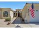 Charming home featuring a decorative front door, elegant stonework, and a well-maintained walkway at 3125 W Desert Ln, Laveen, AZ 85339