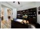 Spacious home office featuring a desk, chair, ceiling fan, and built-in shelving at 3125 W Desert Ln, Laveen, AZ 85339