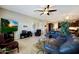 Comfortable living room featuring a large screen TV, plush seating, and an open layout at 3125 W Desert Ln, Laveen, AZ 85339