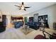 Spacious living room area with a view of the kitchen and dark furnishings at 3125 W Desert Ln, Laveen, AZ 85339