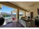 Inviting covered patio, complete with comfortable seating and a view of the pool at 3125 W Desert Ln, Laveen, AZ 85339