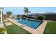 Backyard in-ground pool featuring desert landscaping and a tropical mural at 3125 W Desert Ln, Laveen, AZ 85339
