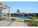 The backyard oasis features an inground pool, patio area and lush landscaping at 3125 W Desert Ln, Laveen, AZ 85339