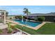 An in-ground pool with a tropical mural, palm tree and desert landscaping at 3125 W Desert Ln, Laveen, AZ 85339