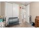 Hallway with closet, chair and a view into the primary bathroom at 35919 N Loemann Dr, San Tan Valley, AZ 85143