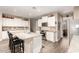 Bright kitchen with white cabinets, granite countertops, stainless steel appliances, and wood flooring at 35919 N Loemann Dr, San Tan Valley, AZ 85143