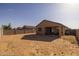 Spacious backyard with covered patio area is ready for personalization and outdoor living at 36987 N Sidewinder Dr, San Tan Valley, AZ 85140