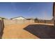 Expansive backyard showcases potential for landscaping and entertainment with privacy fencing at 36987 N Sidewinder Dr, San Tan Valley, AZ 85140