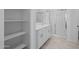 Bright bathroom with double sinks, white cabinetry, and a glass-enclosed shower at 36987 N Sidewinder Dr, San Tan Valley, AZ 85140