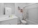 Clean bathroom featuring a vanity, toilet, and bathtub with shower; complemented by decorative wall art at 36987 N Sidewinder Dr, San Tan Valley, AZ 85140