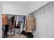 Walk-in closet with ample hanging space and shelving for organized storage at 36987 N Sidewinder Dr, San Tan Valley, AZ 85140
