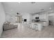 Open-concept living room featuring tile floors, modern decor, and access to the outdoor patio at 36987 N Sidewinder Dr, San Tan Valley, AZ 85140