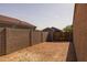 Side yard shows access gate and privacy block wall with potential for various uses at 36987 N Sidewinder Dr, San Tan Valley, AZ 85140