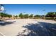 Outdoor basketball court surrounded by trees at 40010 W Ganly Way, Maricopa, AZ 85138