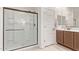 Bathroom featuring a glass enclosed shower, tile floors and a single vanity with ample storage at 40010 W Ganly Way, Maricopa, AZ 85138
