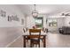 Cozy dining area offering natural light, views of the backyard, with easy access to the kitchen and living area at 40010 W Ganly Way, Maricopa, AZ 85138
