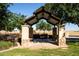Community picnic pavilion with stone pillars and picnic tables at 40010 W Ganly Way, Maricopa, AZ 85138