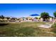 Community playground with covered play area, slide, and climbing structure at 40010 W Ganly Way, Maricopa, AZ 85138