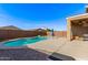 Backyard featuring a private in-ground pool, concrete patio and privacy fence at 40010 W Ganly Way, Maricopa, AZ 85138