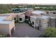 Aerial view of the estate with meticulously designed grounds, showcasing the unique architecture and outdoor living spaces at 41667 N 113Th Pl, Scottsdale, AZ 85262