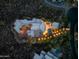 Drone image of sprawling estate featuring stone walkways, patios, pool, and desert landscaping at 41667 N 113Th Pl, Scottsdale, AZ 85262