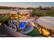 Stunning backyard with a multi-tiered pool, spa, and outdoor entertaining area perfect for relaxation and gatherings at 41667 N 113Th Pl, Scottsdale, AZ 85262