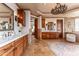Elegant primary bathroom with dual sinks, vanity, and jacuzzi at 41667 N 113Th Pl, Scottsdale, AZ 85262