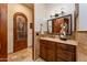 Bathroom vanity with stone countertop and custom wood cabinet at 41667 N 113Th Pl, Scottsdale, AZ 85262