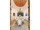Dining room with decorative brick ceiling, chandelier, and decorative window at 41667 N 113Th Pl, Scottsdale, AZ 85262