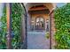 Front door and wrought iron entry gate with brick pavers leading to front door at 41667 N 113Th Pl, Scottsdale, AZ 85262