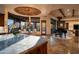 Open-concept living space boasts an abundance of natural light, a piano, and luxurious finishes at 41667 N 113Th Pl, Scottsdale, AZ 85262