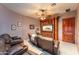 Home theater featuring leather recliners and a custom entertainment center for the ultimate viewing experience at 41667 N 113Th Pl, Scottsdale, AZ 85262