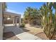 The beautiful backyard has a covered patio and drought tolerant landscaping perfect for outdoor enjoyment at 43690 W Knauss Dr, Maricopa, AZ 85138