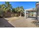 This large backyard has a covered patio and drought tolerant landscaping for outdoor enjoyment at 43690 W Knauss Dr, Maricopa, AZ 85138
