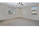Spacious bedroom offering carpet flooring, ceiling fan, and good natural light at 43690 W Knauss Dr, Maricopa, AZ 85138