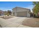 Attractive single-story home with desert landscaping, a two-car garage, and a welcoming curb appeal at 43690 W Knauss Dr, Maricopa, AZ 85138