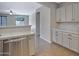 Kitchen featuring stainless steel dishwasher with neutral colored cabinets at 43690 W Knauss Dr, Maricopa, AZ 85138