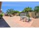 Spacious backyard with a patio area, perfect for outdoor dining and entertainment at 45042 W Cypress Ln, Maricopa, AZ 85139