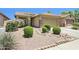 Attractive single-story home with a neutral stucco exterior, desert landscaping, and a two-car garage at 45042 W Cypress Ln, Maricopa, AZ 85139