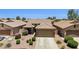 Charming single-Gathering home featuring well-manicured landscaping, a two-car garage, and a welcoming front entry at 45042 W Cypress Ln, Maricopa, AZ 85139