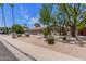 Charming home with a desert landscaped front yard and a spacious three-car garage at 4532 E Sandra Ter, Phoenix, AZ 85032