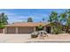 Charming home featuring a three-car garage, desert landscaping and a well-manicured lawn at 4532 E Sandra Ter, Phoenix, AZ 85032